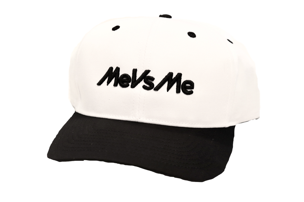 White and black MeVsMe snapback with MeVsMe embroidered on the front.