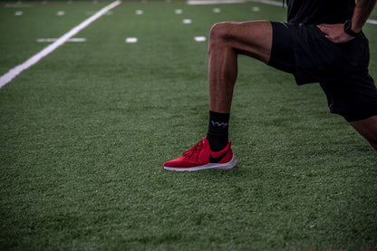 Athlete wearing the black MVM Training Crew Socks